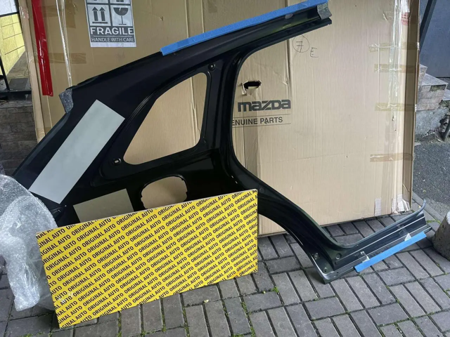 KMY671410 Mazda Бічна частина задня ліва