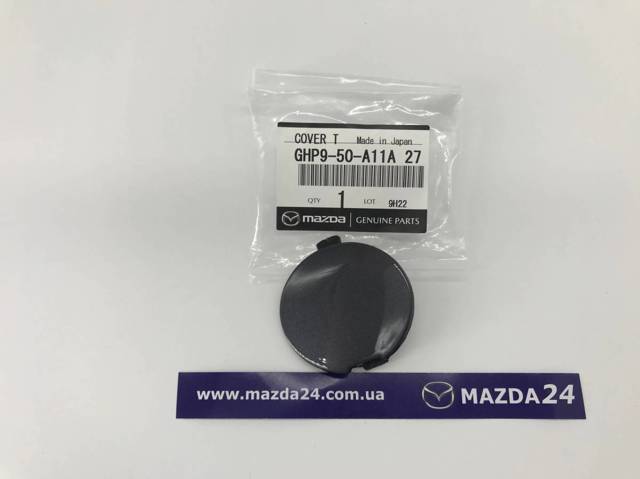 GHP950A11A27 Mazda Заглушка бампера буксирувального гака, передня