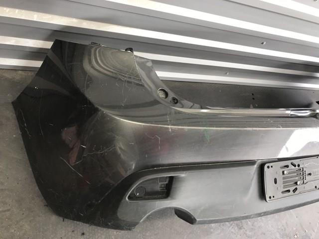 Бампер задній Mazda BCW850221
